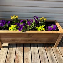 Cedar Planter Box Filled with Flowers on Deck